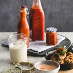 Kilner Swing Top Square Glass Bottle | 8.25oz -Le Creuset shop kilner clip top 9 ounce square bottle lifestyle